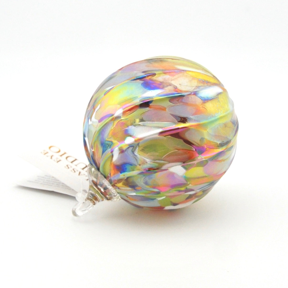 Multicolored glass ornament on a white background