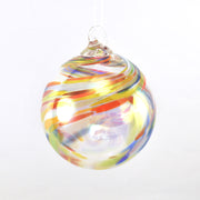 Colorful glass ornament with swirl pattern on a white background