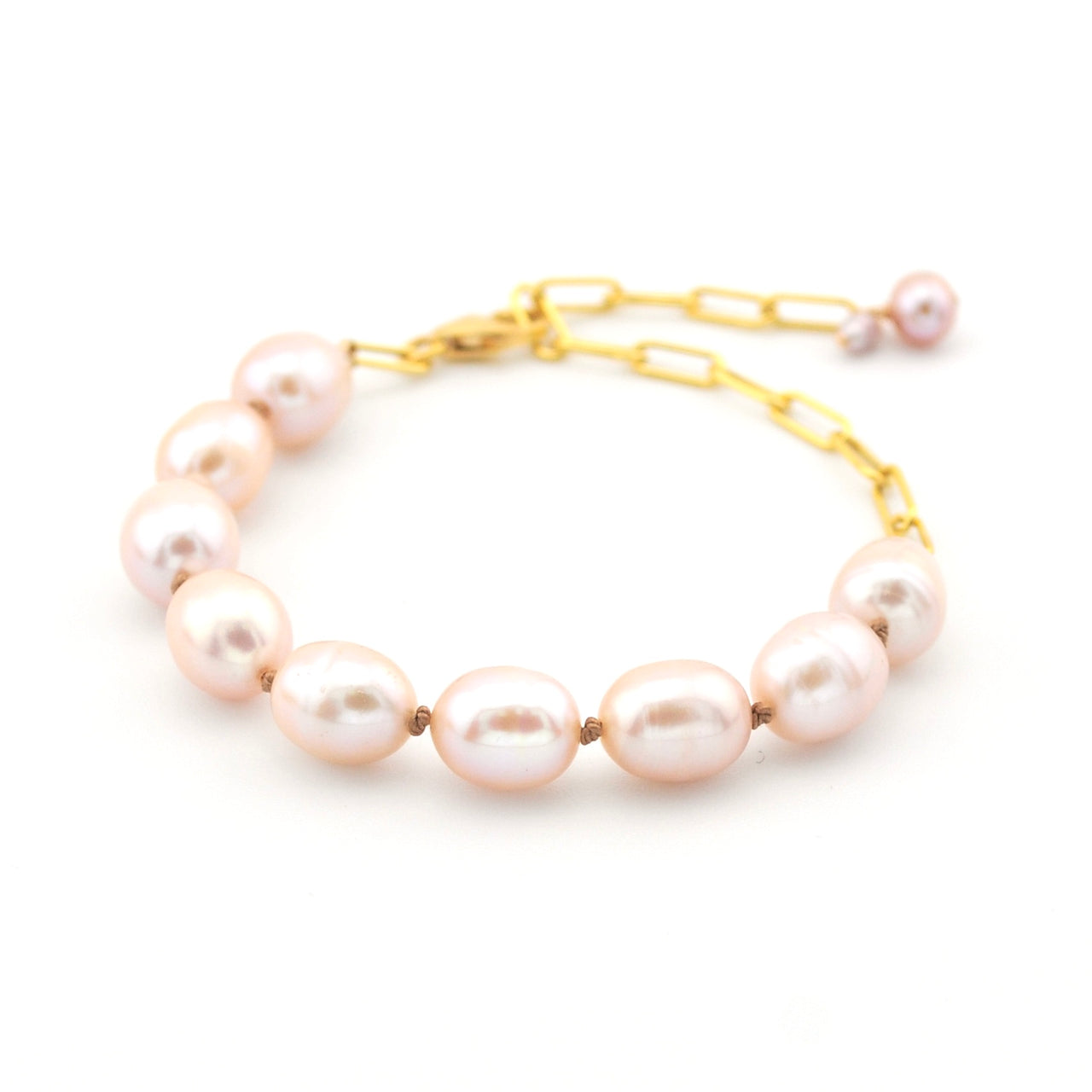 Pearl bracelet with gold chain on a white background