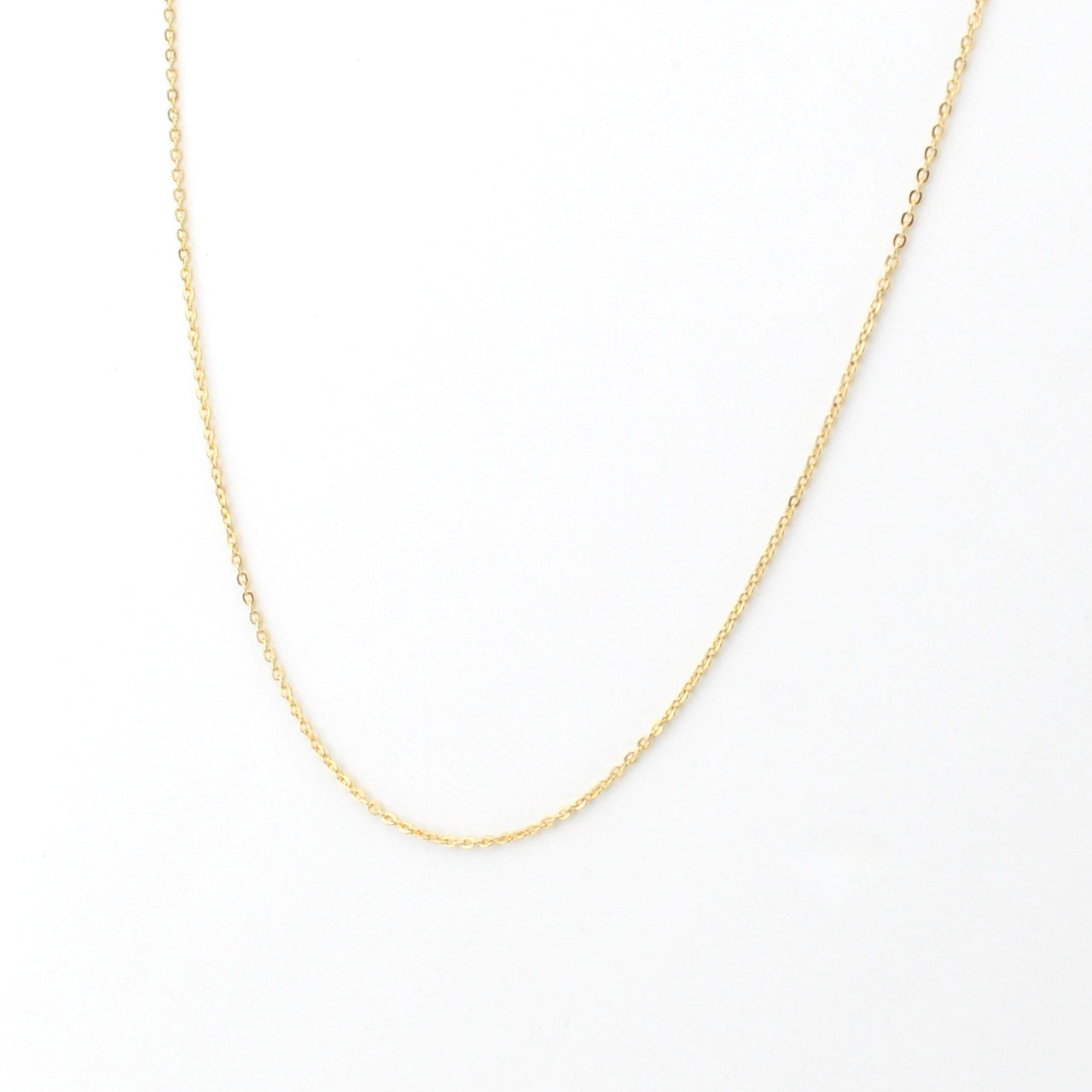 Gold chain on white background