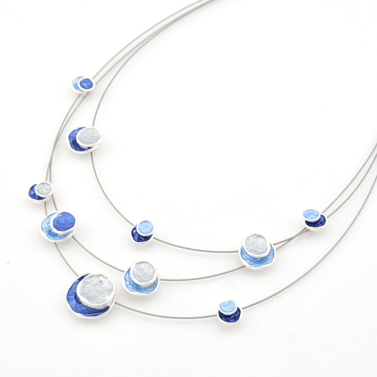 Necklace with blue and white circular pendants on a white background