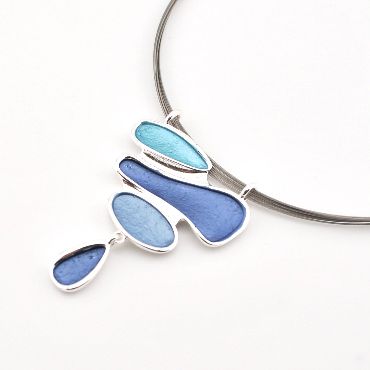 Necklace with blue pendant on a white background