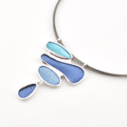 Necklace with blue pendant on a white background
