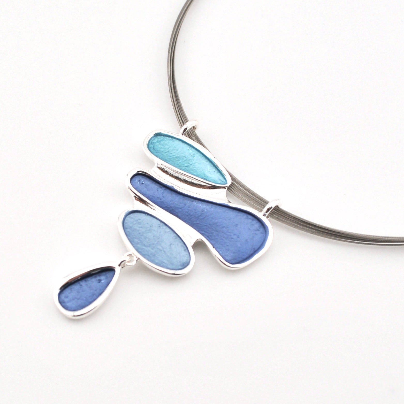 Necklace with blue pendant on a white background