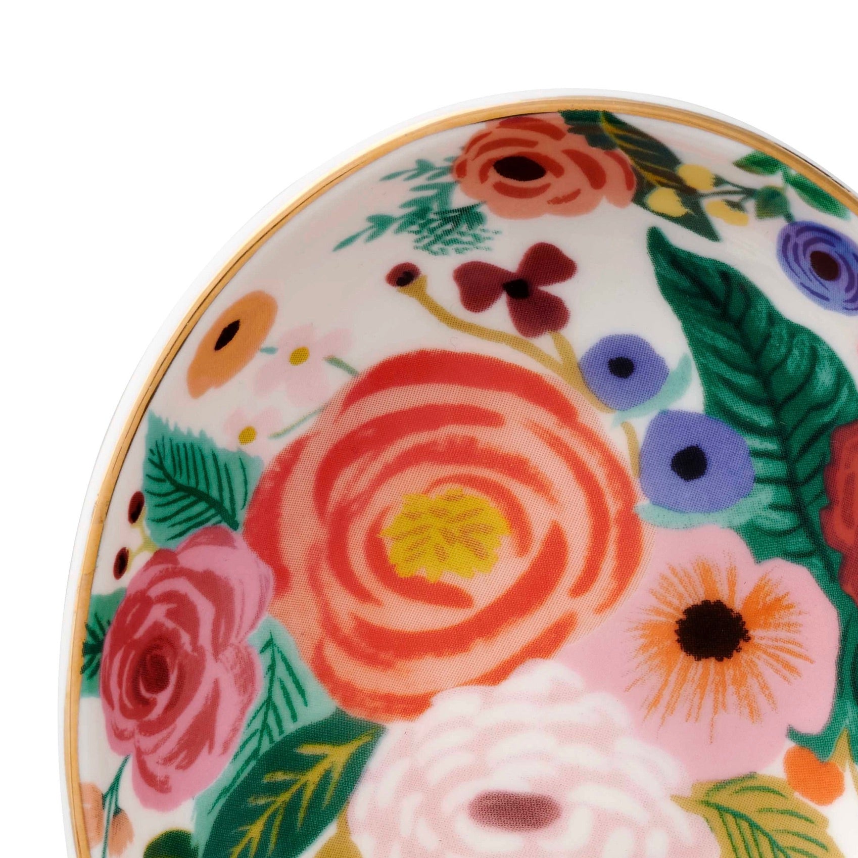 Decorative spoon rest with colorful floral design on a white background