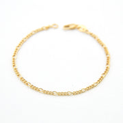 Gold chain bracelet on a white background