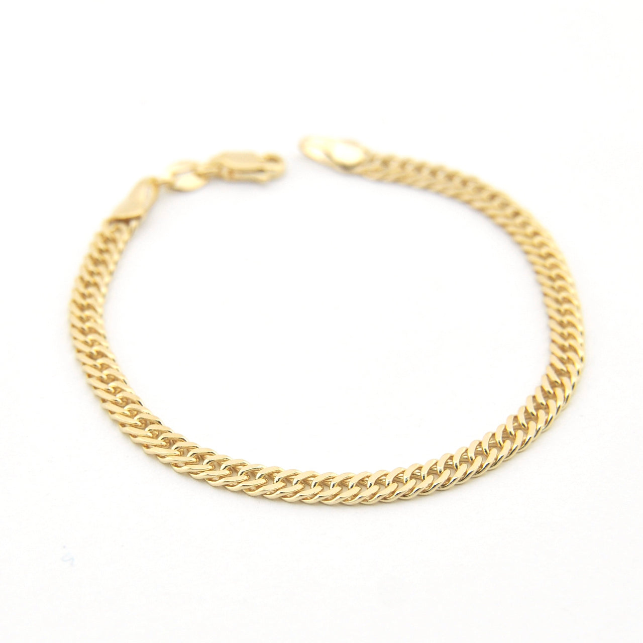 Gold chain bracelet on a white background