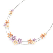 Neck wire with purple, peach and gold flowers on white background.