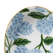 Decorative plate with blue floral and green leaf pattern on a white background