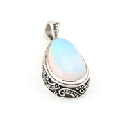 Opal pendant with silver setting on a white background