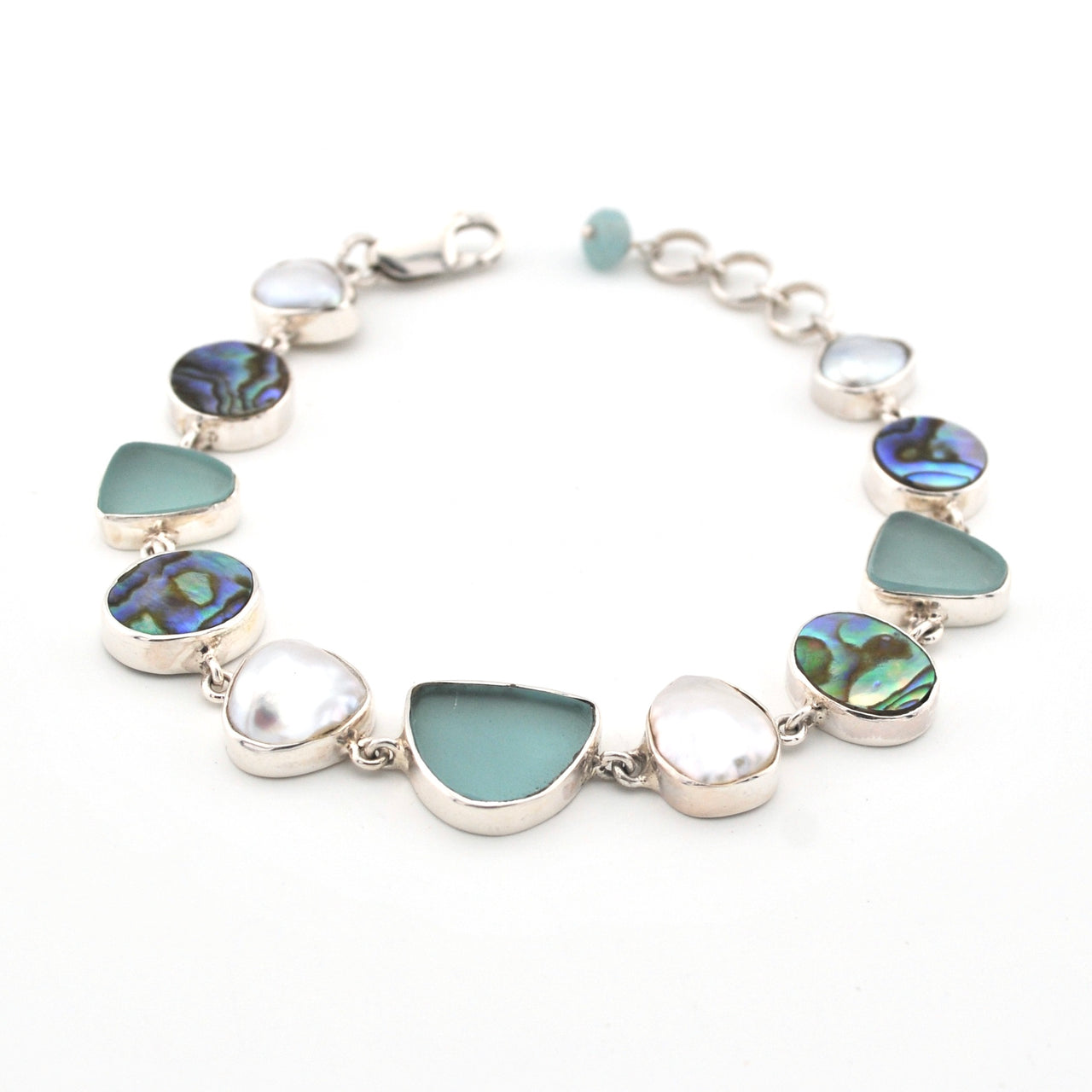 Bracelet with green and silver beads on a white background