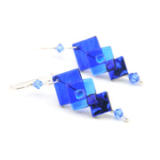 Blue square-shaped earrings on a white background