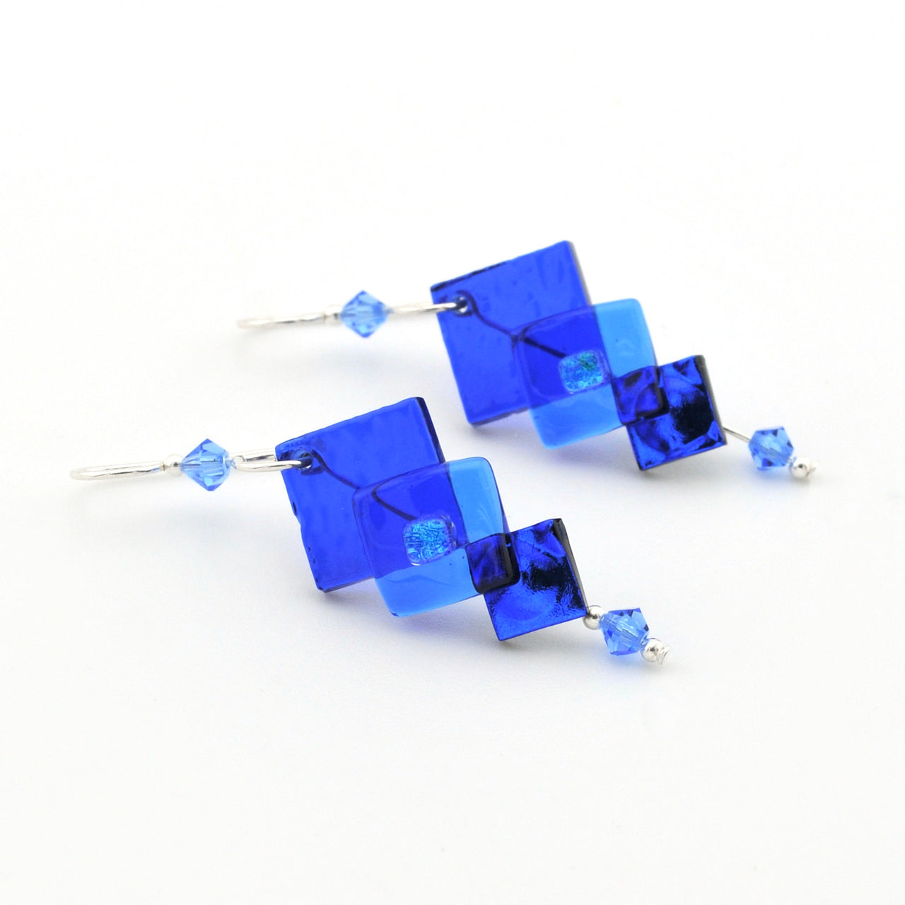 Blue square-shaped earrings on a white background