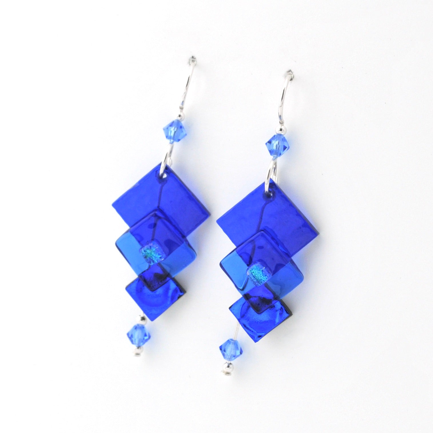 Blue square-shaped earrings with small beads on a white background