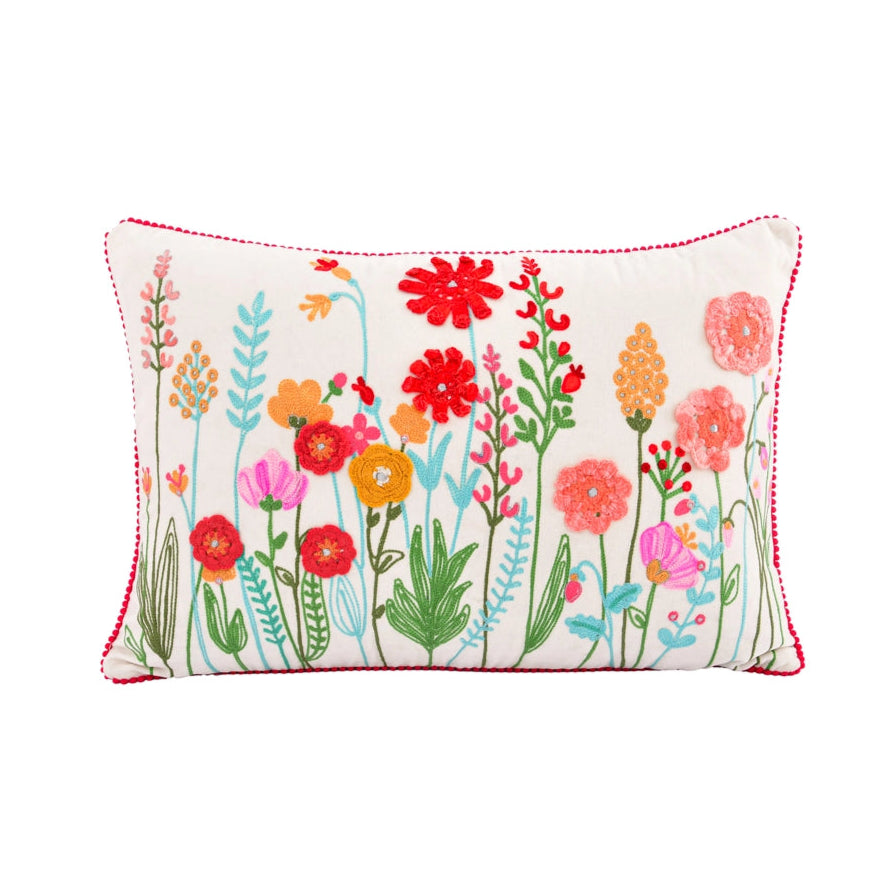 Decorative pillow with colorful floral pattern on a white background