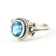 Side View Silver Blue Topaz 6x8mm Oval Scroll Ring