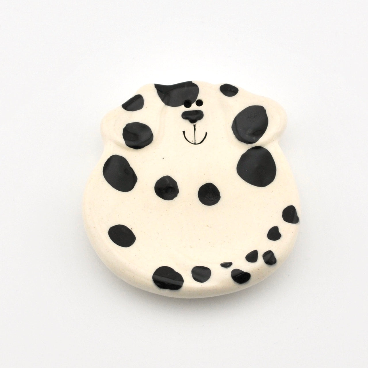 Round ceramic dish with a dalmatian dog design on a white background