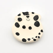 Round ceramic dish with a dalmatian dog design on a white background