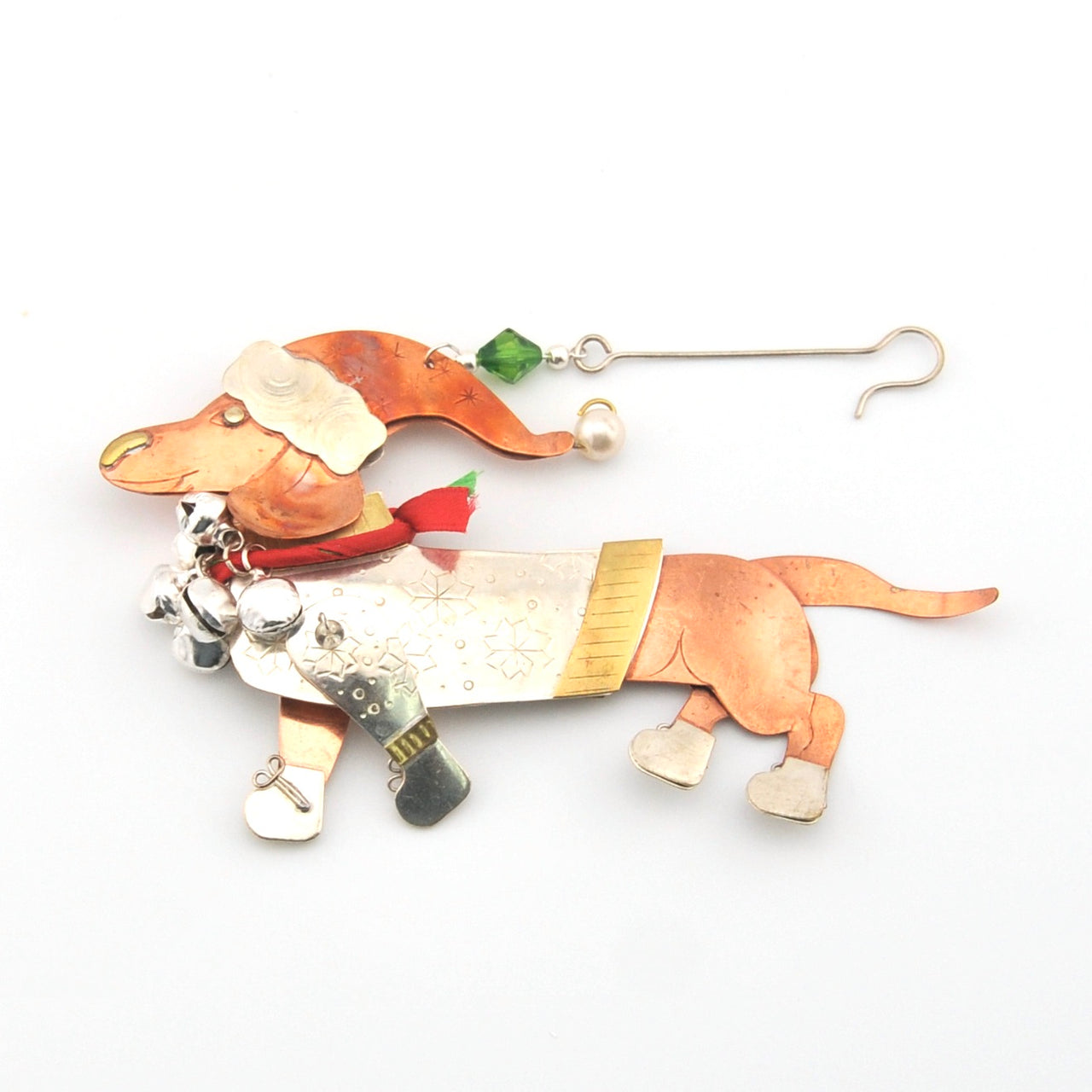 Decorative dog ornament with a hat and scarf on a white background
