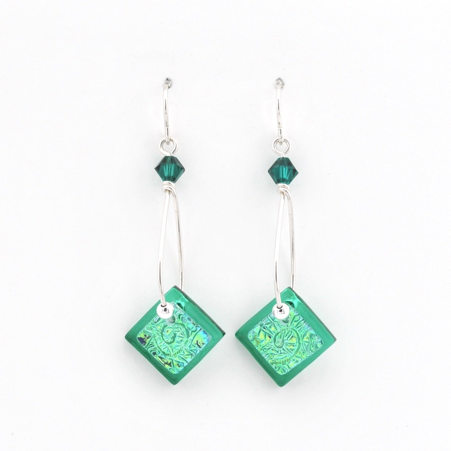 Green square earrings with silver hooks on a white background