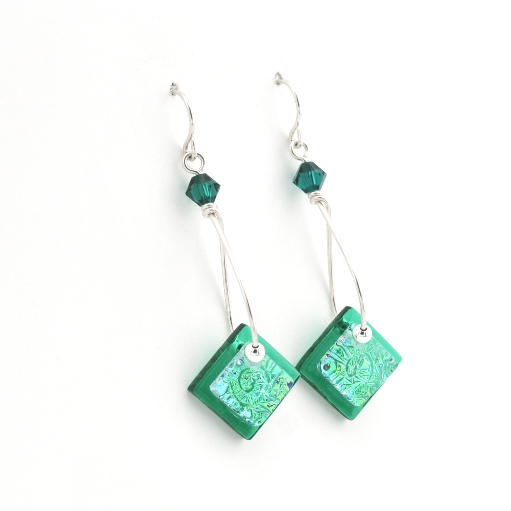 Green square earrings with beaded accents on a white background