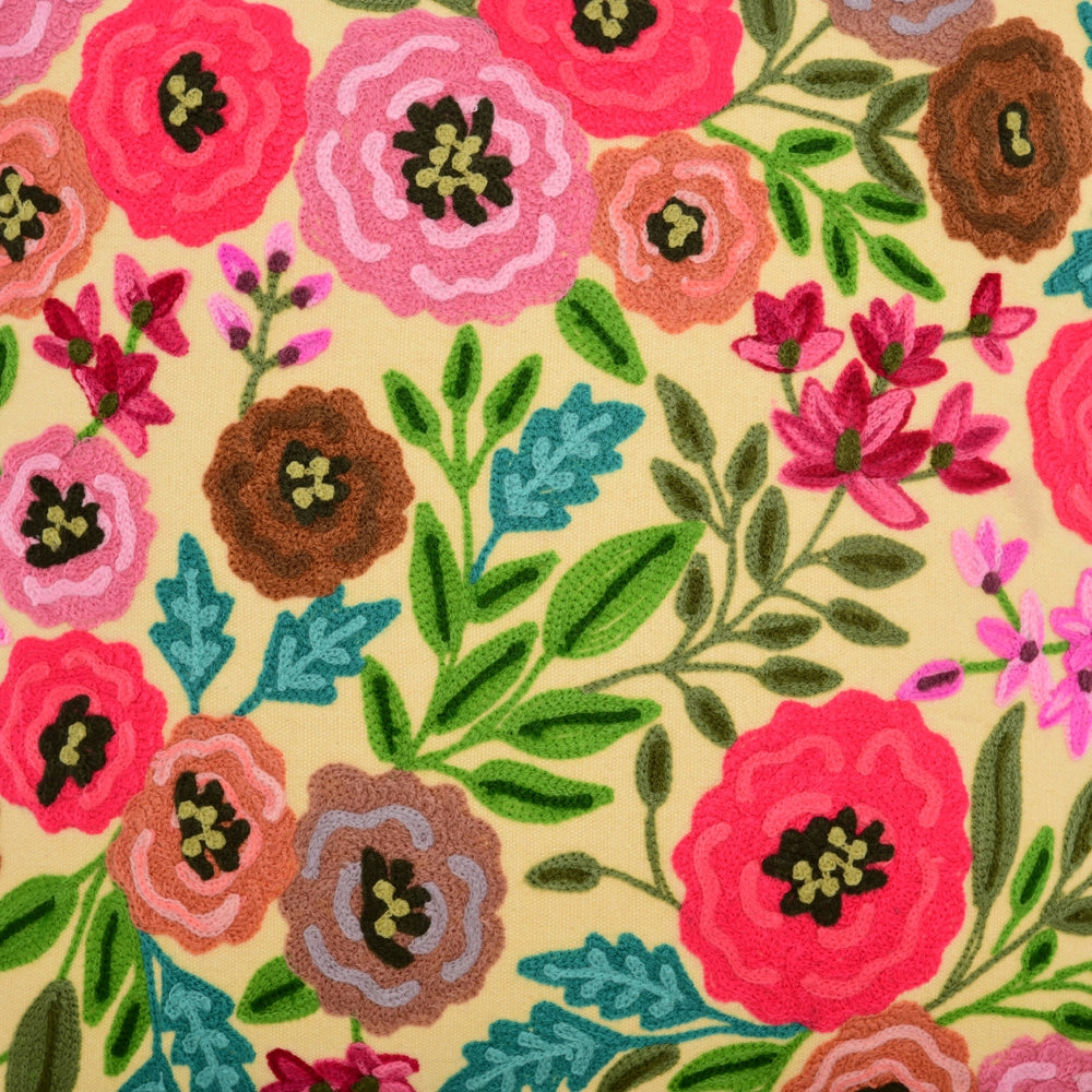 Colorful floral pattern with pink, red, and green flowers on a beige background