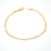 Gold chain bracelet on a white background