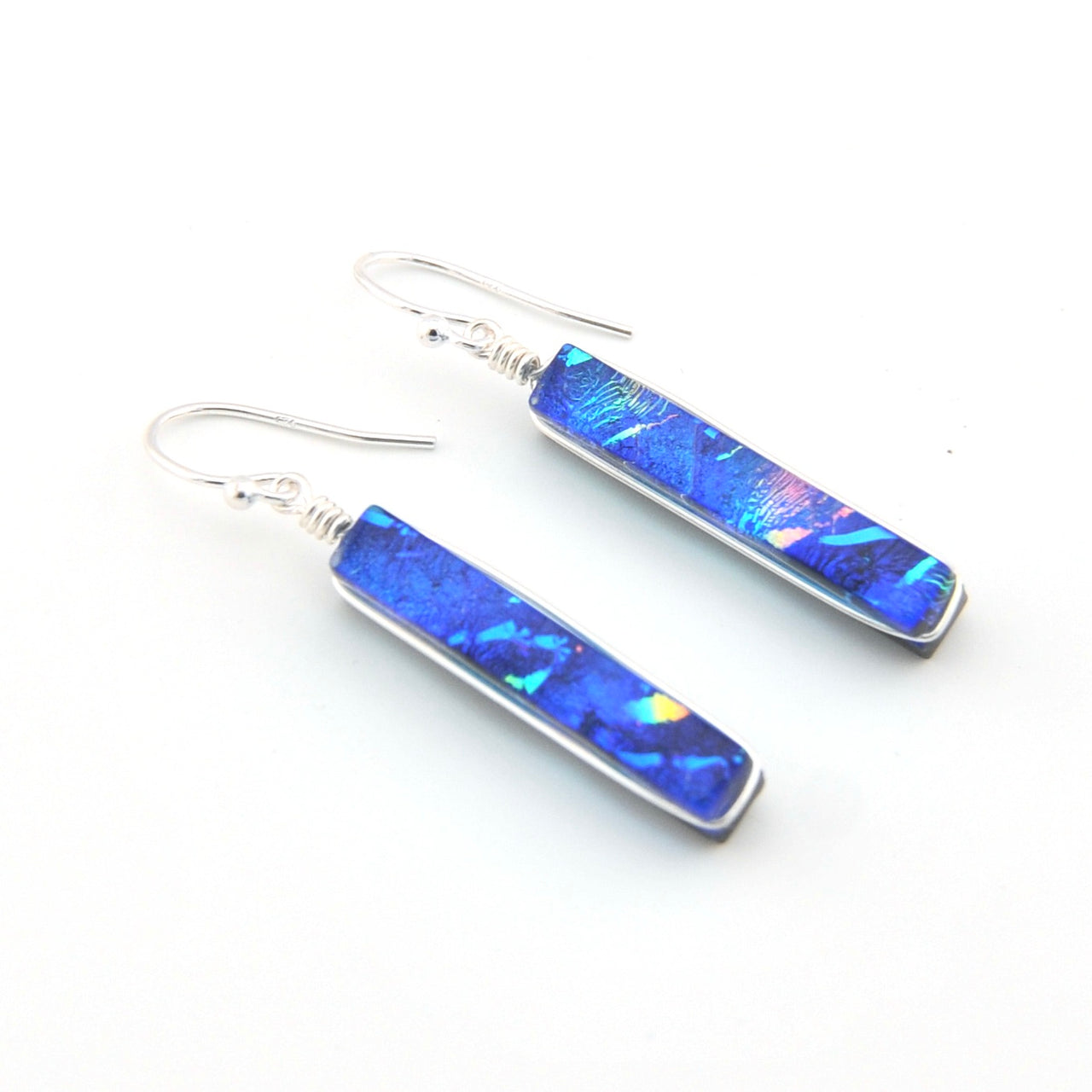 Pair of blue bar earrings on a white background