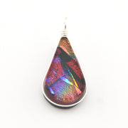 Teardrop-shaped pendant with multicolored iridescent finish on a white background
