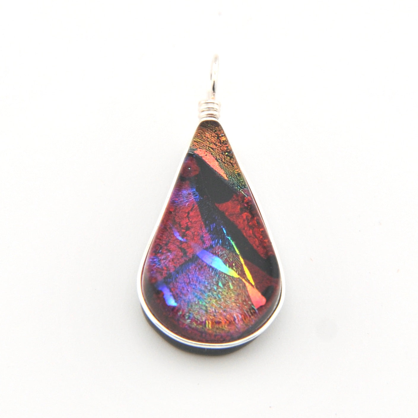 Teardrop-shaped pendant with multicolored iridescent finish on a white background