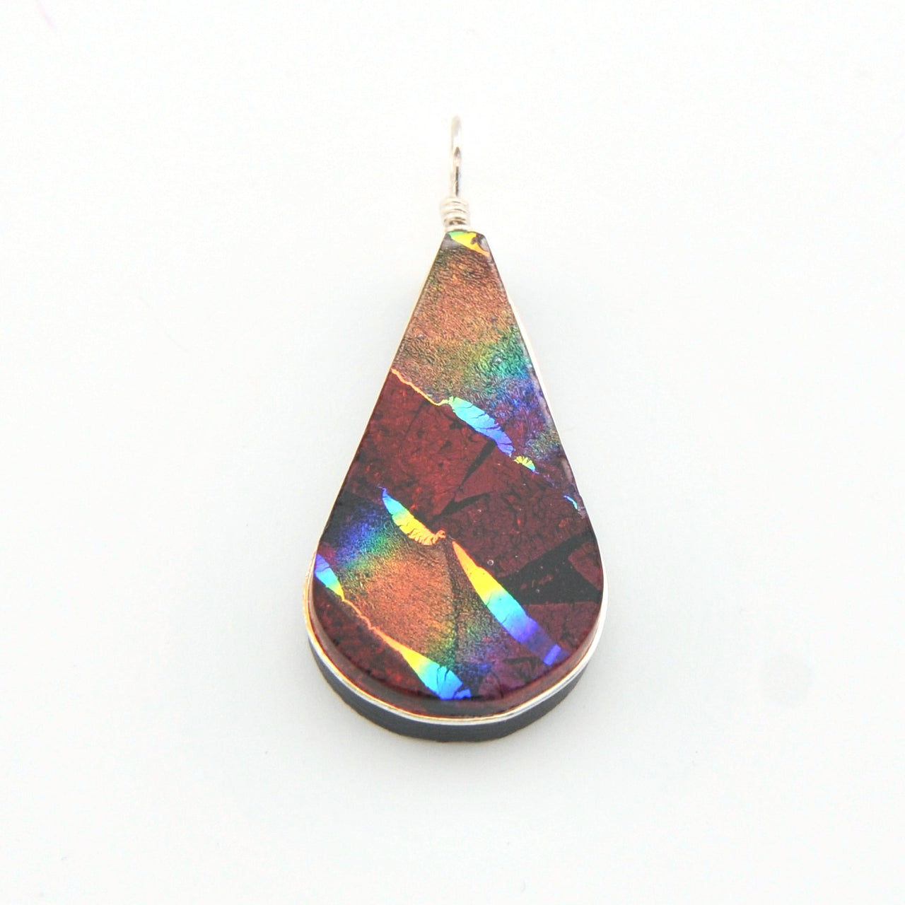 Teardrop-shaped pendant with multicolored iridescent finish on a white background