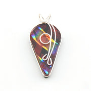 Multicolored teardrop pendant with silver wire design on a white background