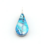 Teardrop-shaped blue pendant on a white background