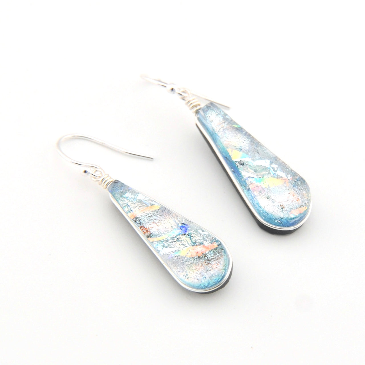 Teardrop-shaped earrings with a multicolored design on a white background