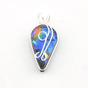 Multicolored teardrop pendant with silver outline on a white background