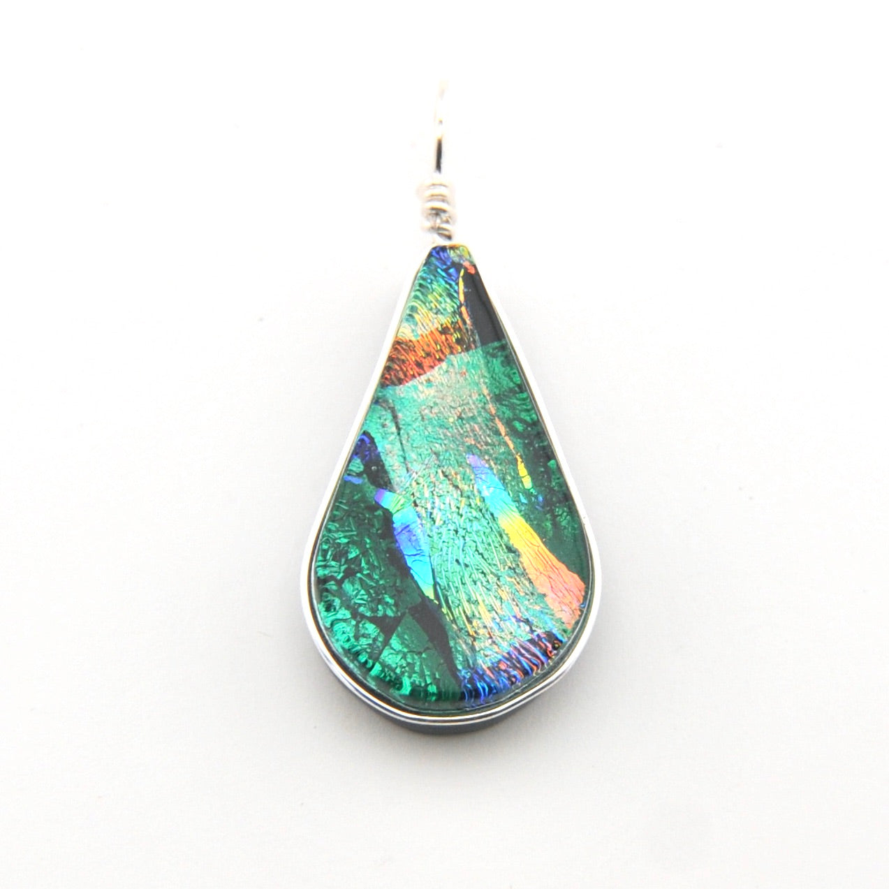 Teardrop-shaped pendant with multicolored iridescent surface on a white background