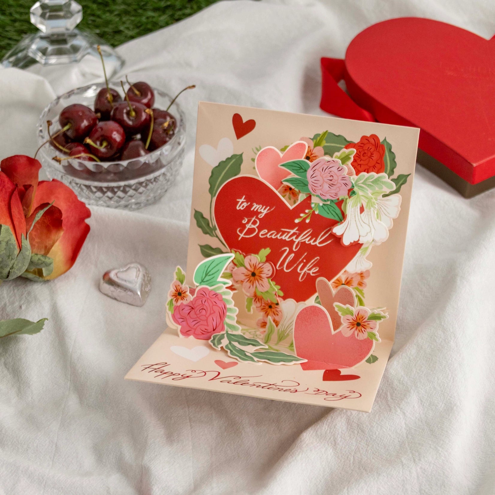 Valentine's Day card for a wife with decorative elements on a white fabric background.