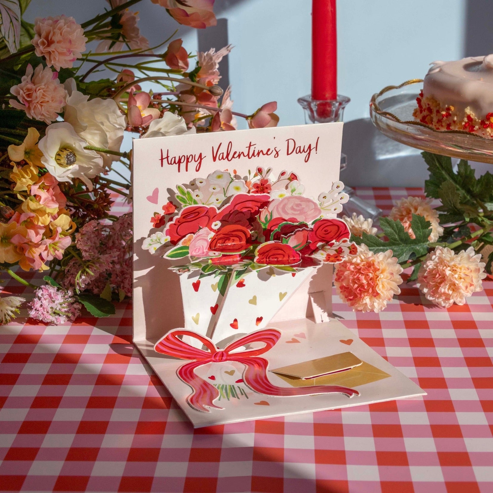 Valentine's Day card with flowers on a checkered tablecloth