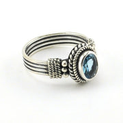 Side View Sterling Silver Blue Topaz 6x8mm Oval 4 Band Ring