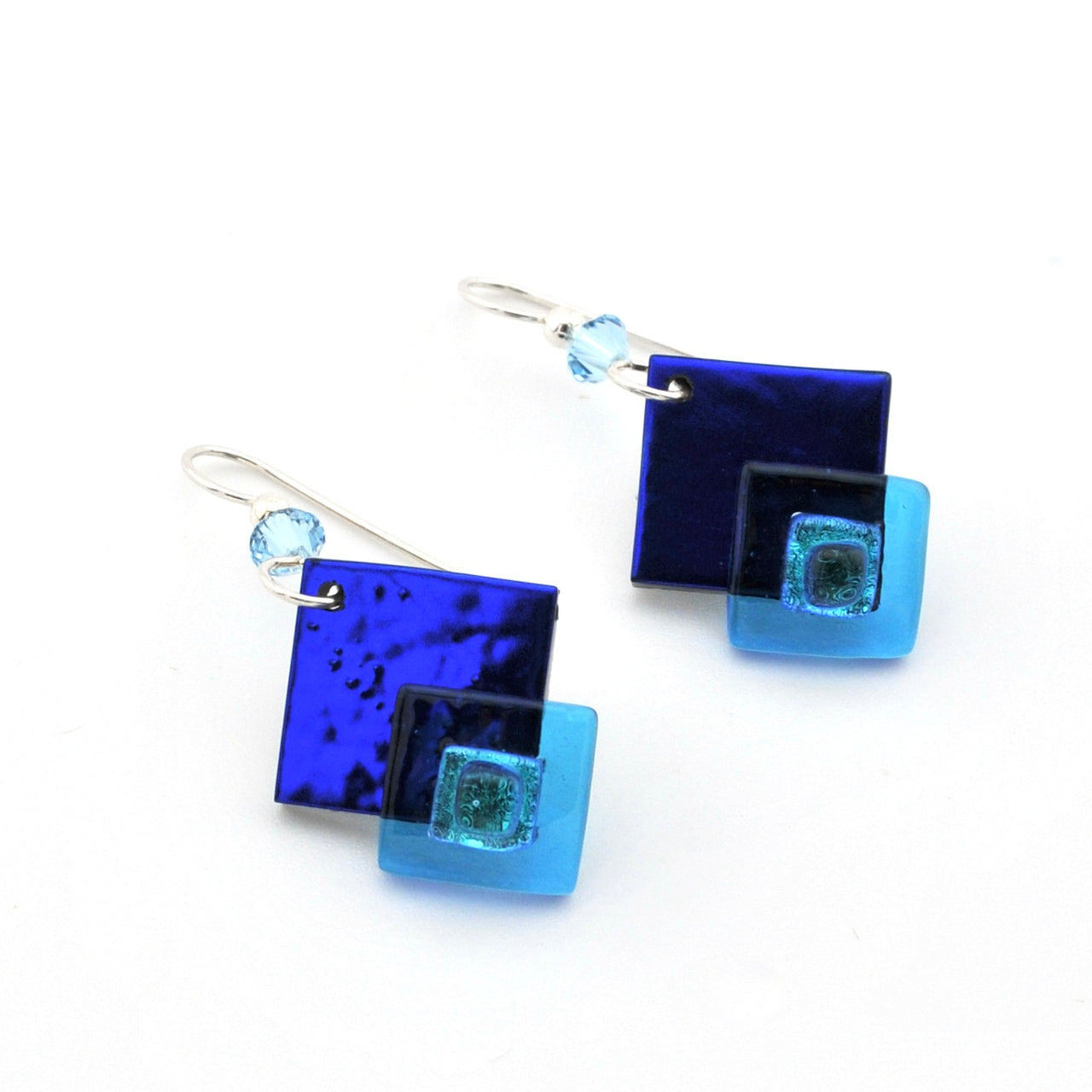 Blue square glass earrings on a white background