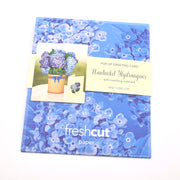 Packaged pop-up greeting card with Nantucket Hydrangeas design on a blue floral background, featuring 'freshcut paper' branding.