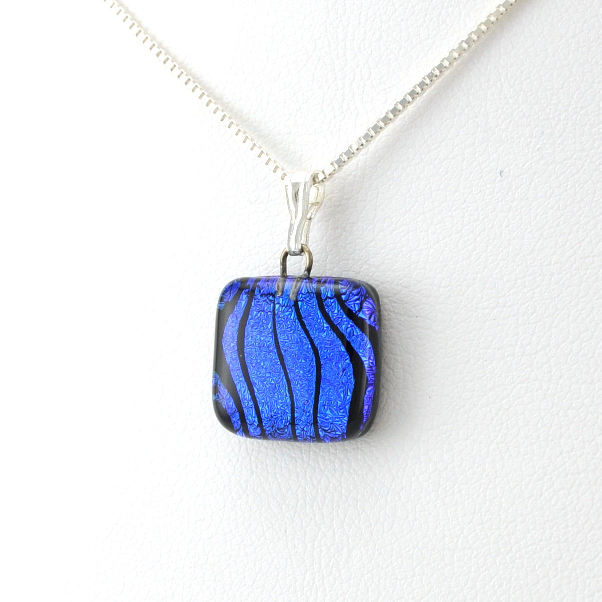 Side View Glass Whorl Blue Charm Necklace