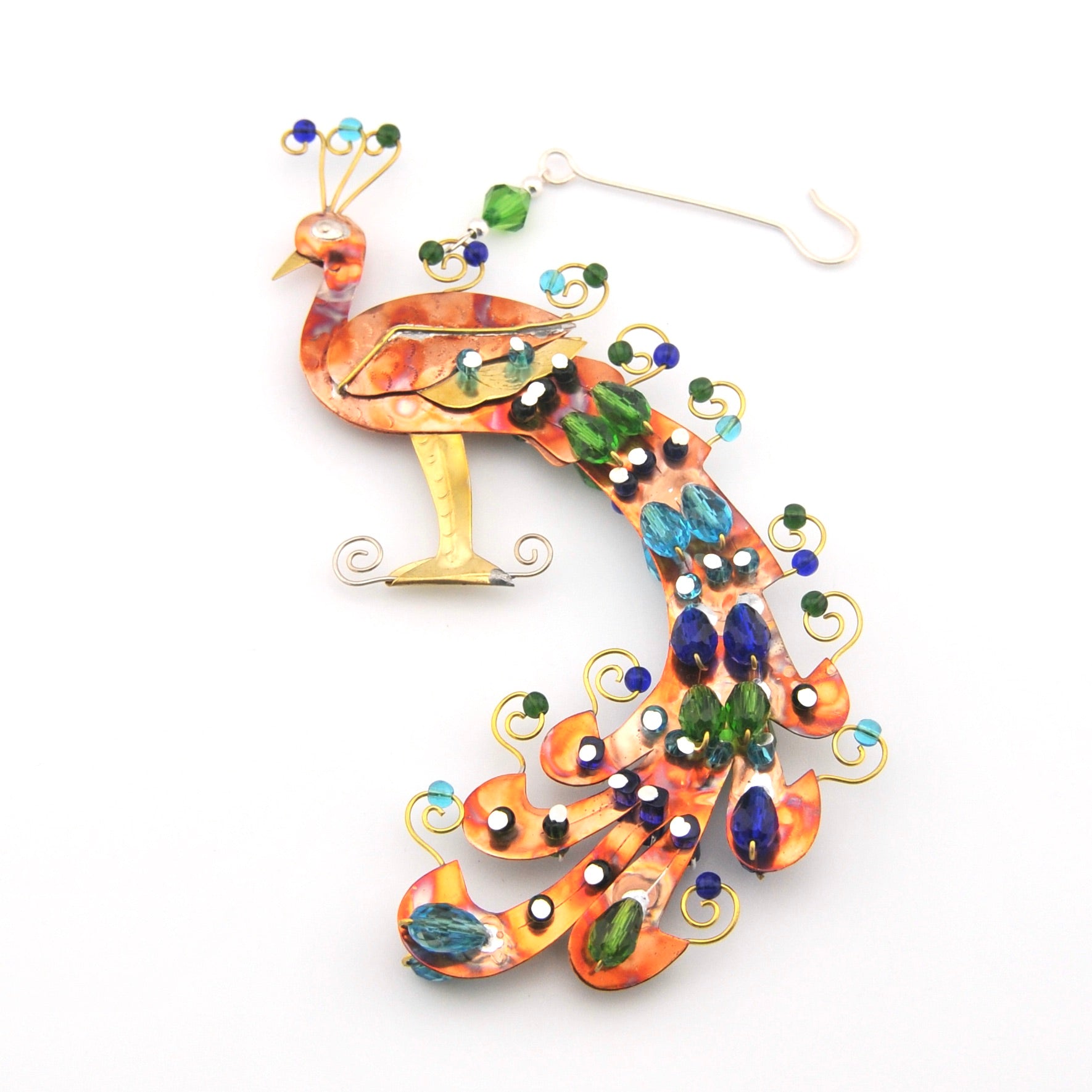 Decorative peacock ornament with colorful beads on a white background