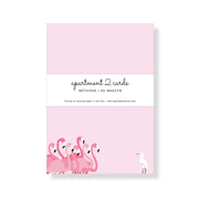 Notepad with pink flamingo design on a white background