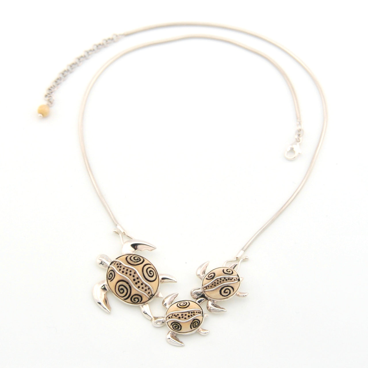 Necklace with turtle-shaped pendants on a white background