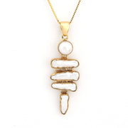 Gold necklace with a unique pendant on a white background