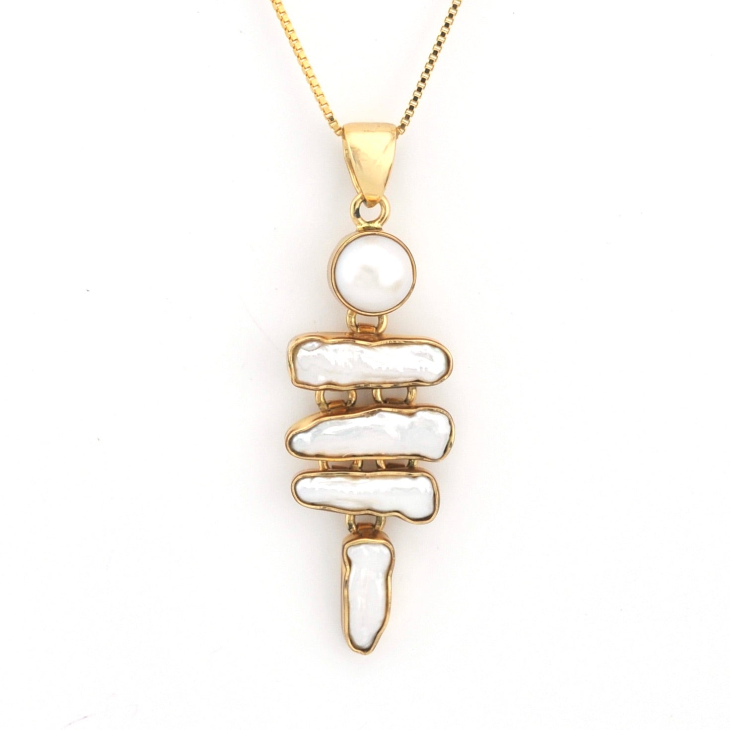 Gold necklace with a unique pendant on a white background