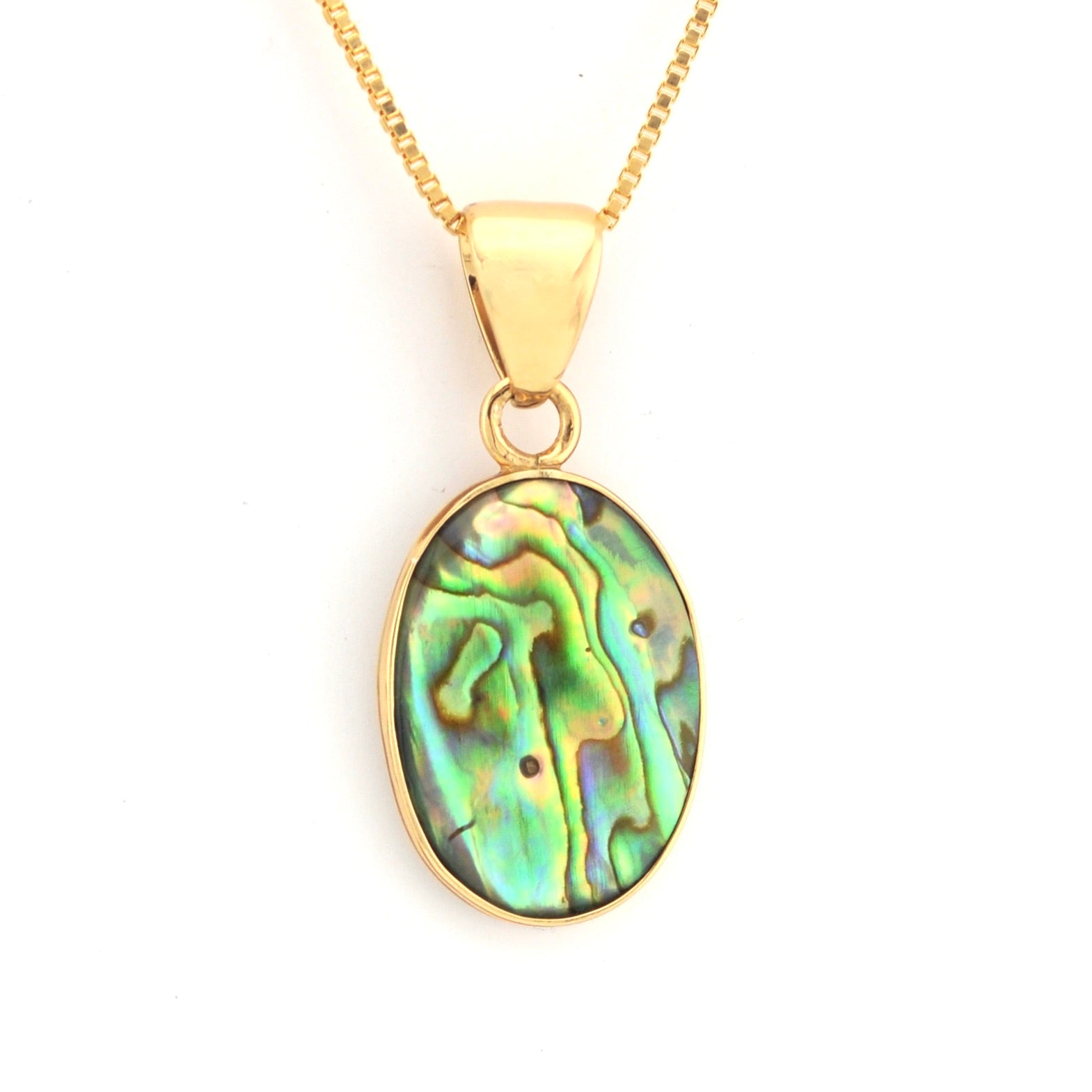 Gold necklace with a colorful pendant on a white background