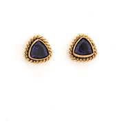 Pair of gold-trimmed purple gemstone earrings on a white background