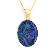 Gold necklace with a blue oval pendant on a white background